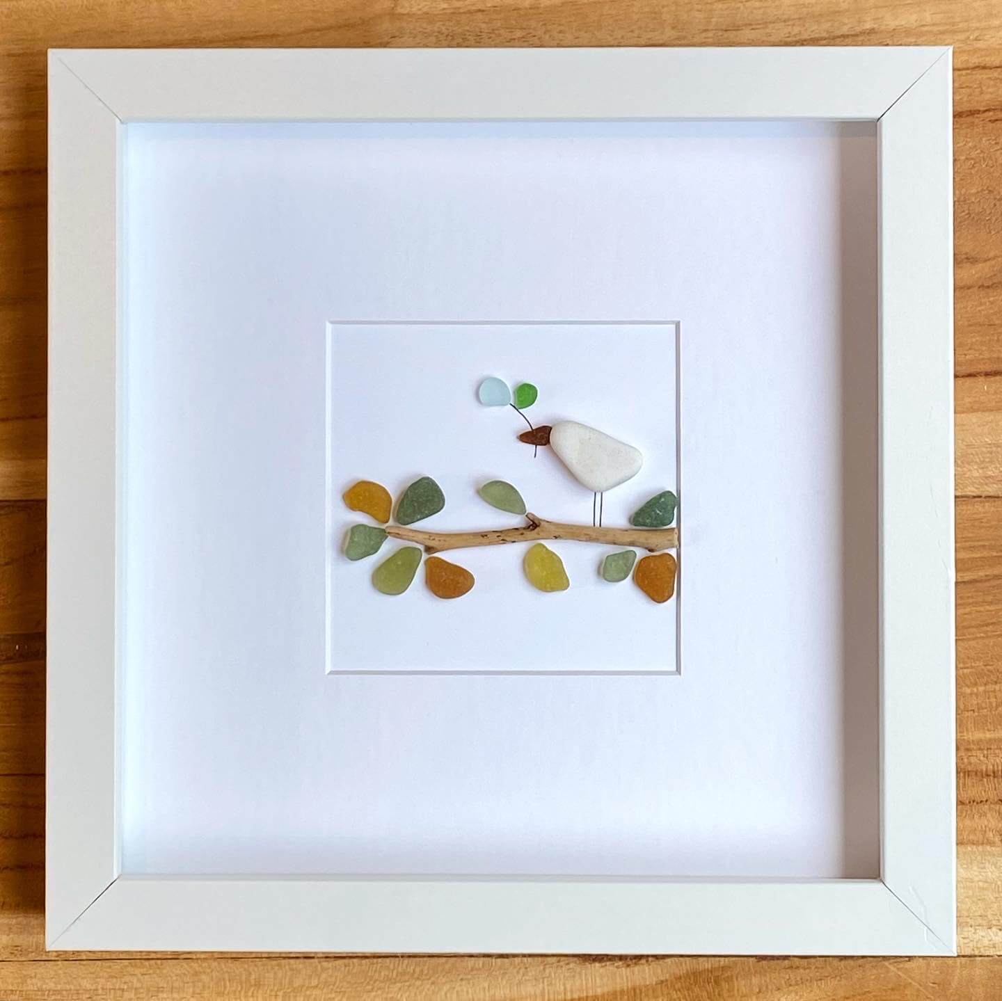 bird on branch sea glass art